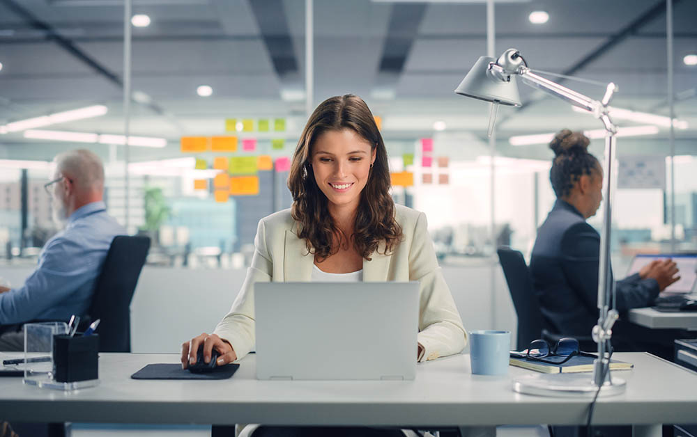 A woman works on a computer