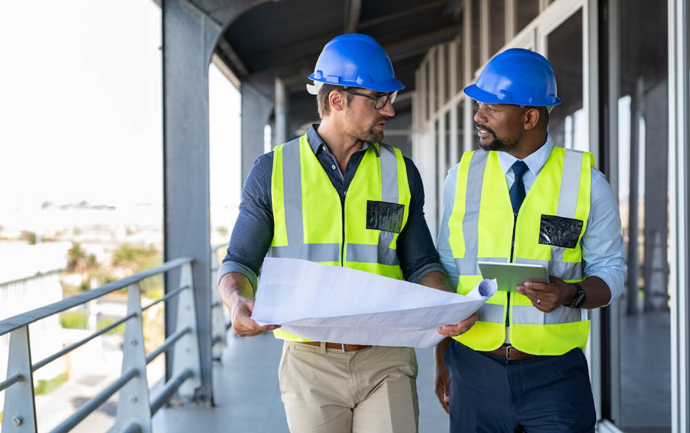 Workers chat on a construction site