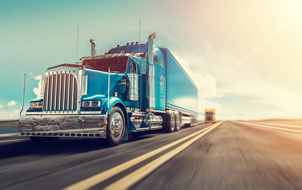 A truck drives along a road.