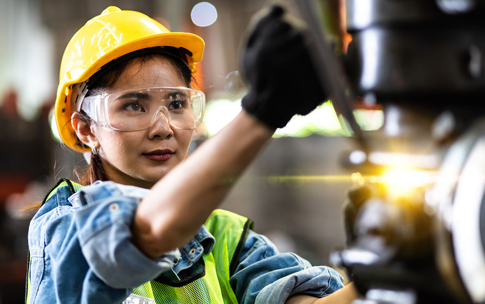 An employee operates machinery