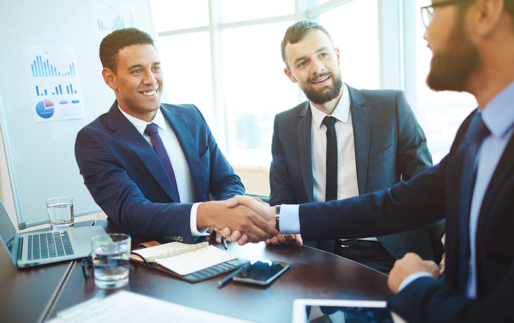 Two businessmen shake hands