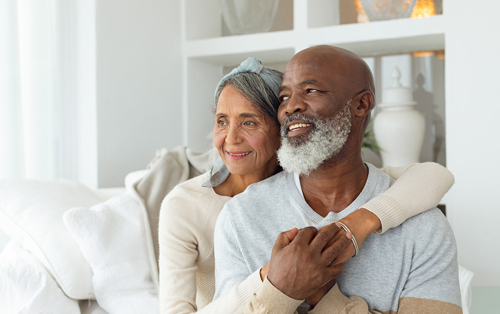 Older couple holding one another