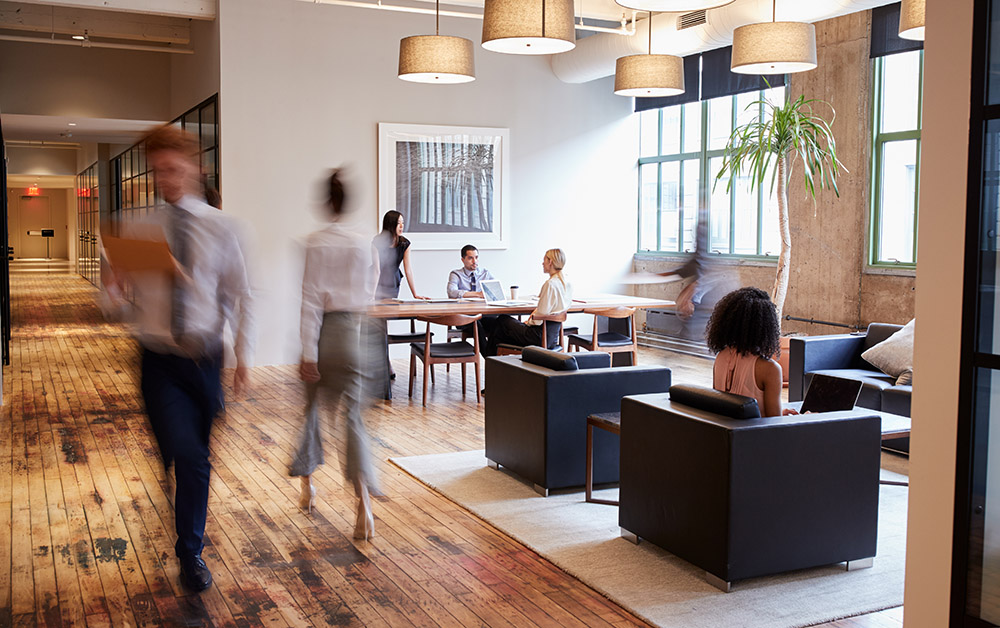 People congregate in a office common area